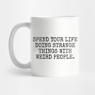 Spend your life doing strange things Mug